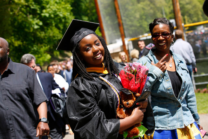Graduate with fresh flowers